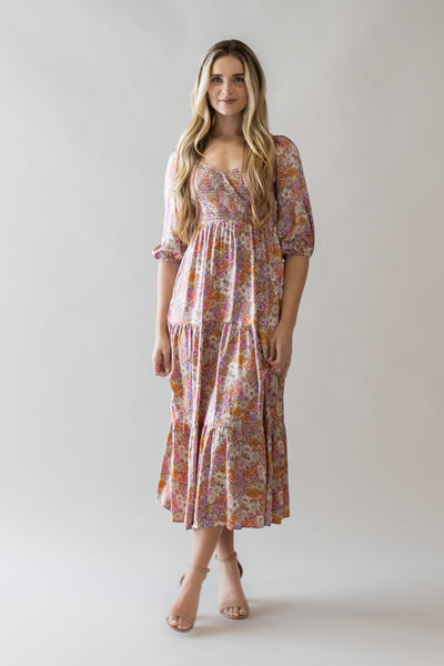This is a modest dress with a wrap bodice and silky soft fabric and floral details.