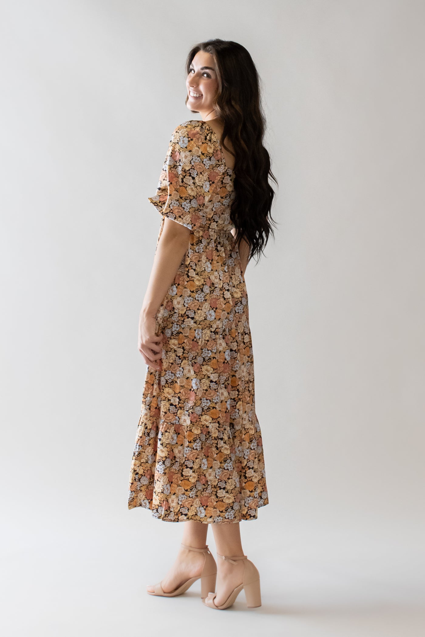 This is the back of a modest dress with orange and yellow details.