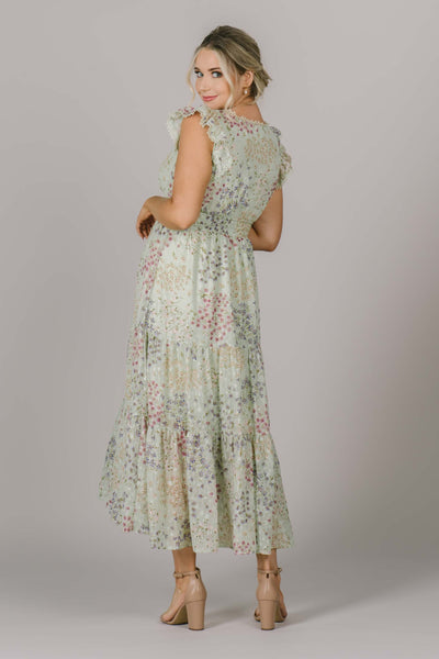 Beautiful modest dress with tiered skirt and high back. Floral pattern adds a fun pop of color.
