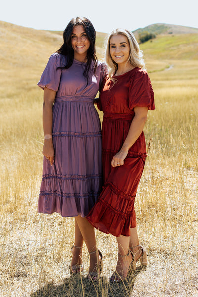 Two friend posing together in matchings dress.