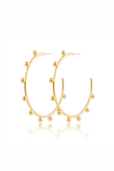 These are gold hoops with beaded details on them.
