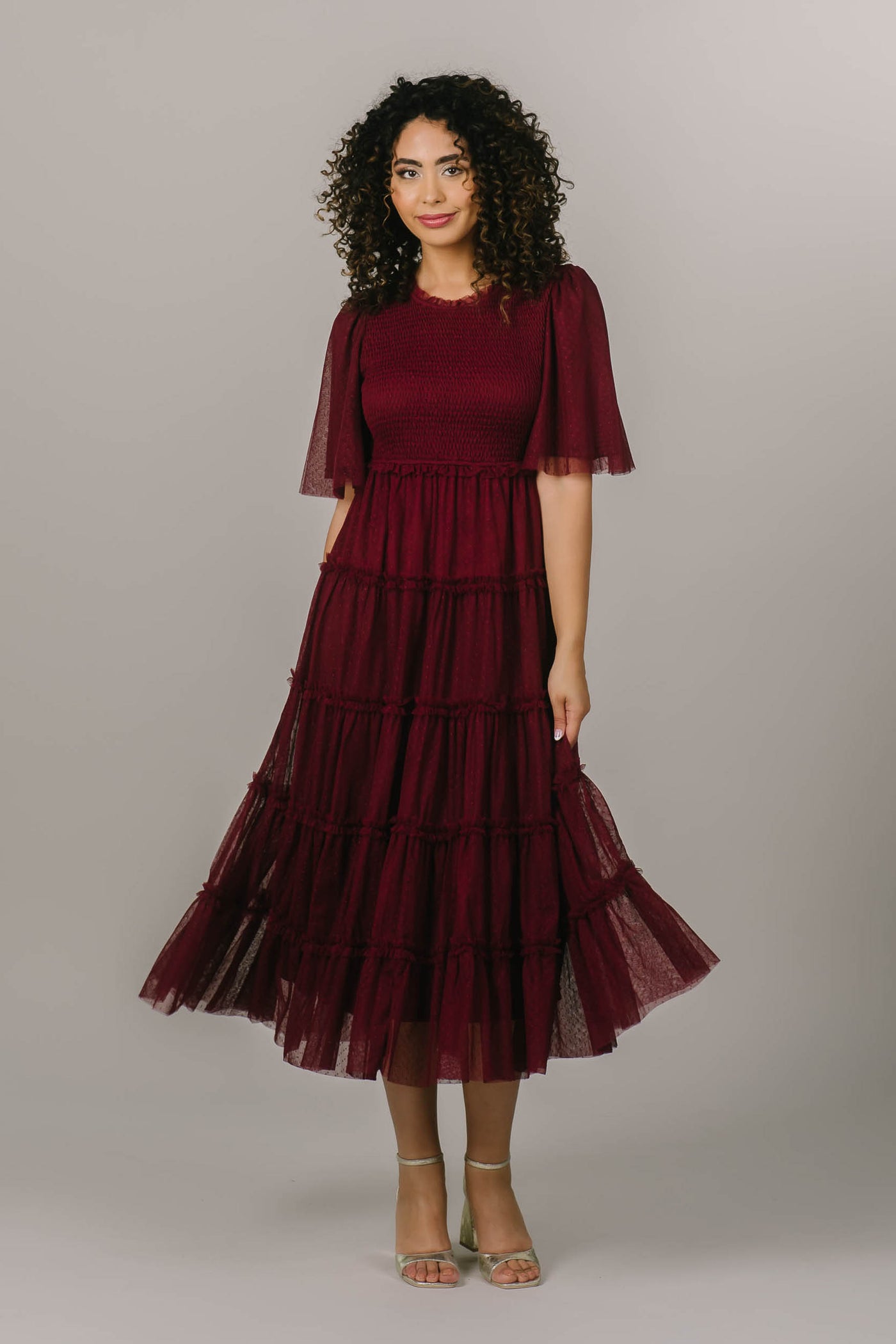 This is a modest holiday dress perfect for all holiday parties and it is a beautiful plum color.