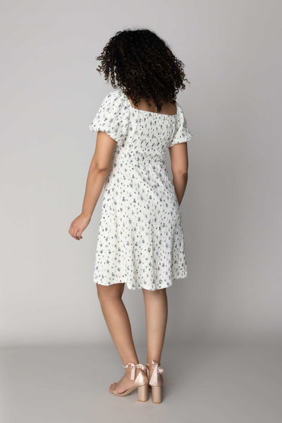 This modest dress features a blue floral pattern and a fun textured fabric.