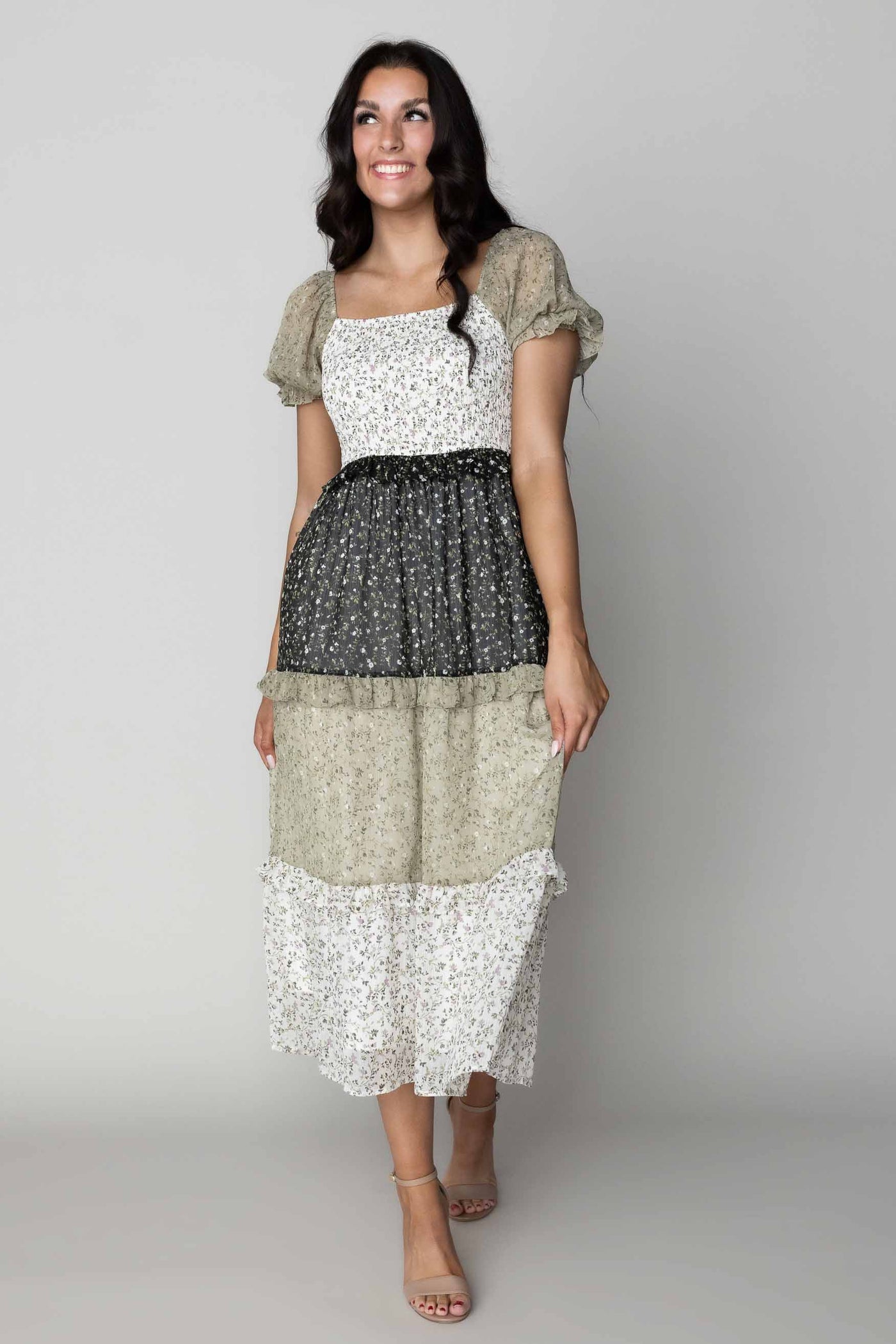 This is a modest dress wih tiered skirt details and features multiple colors on each tier.