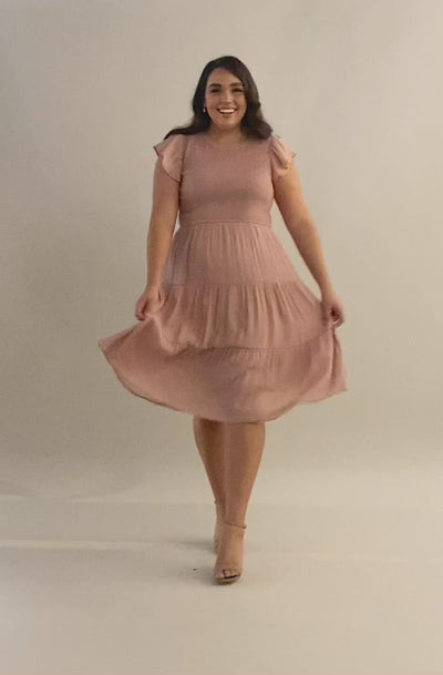 Video of a short sleeve dress with smocked bodice and three tiered panels for the skirt. Modest Dresses - - Everyday Dresses - Modest Prom Dress - Formalwear Modest Dresses - Bridesmaid Modest Dresses.