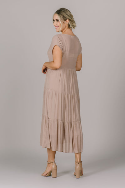 This modest dress in olive flows effortlessly with the tiers in the skirt.