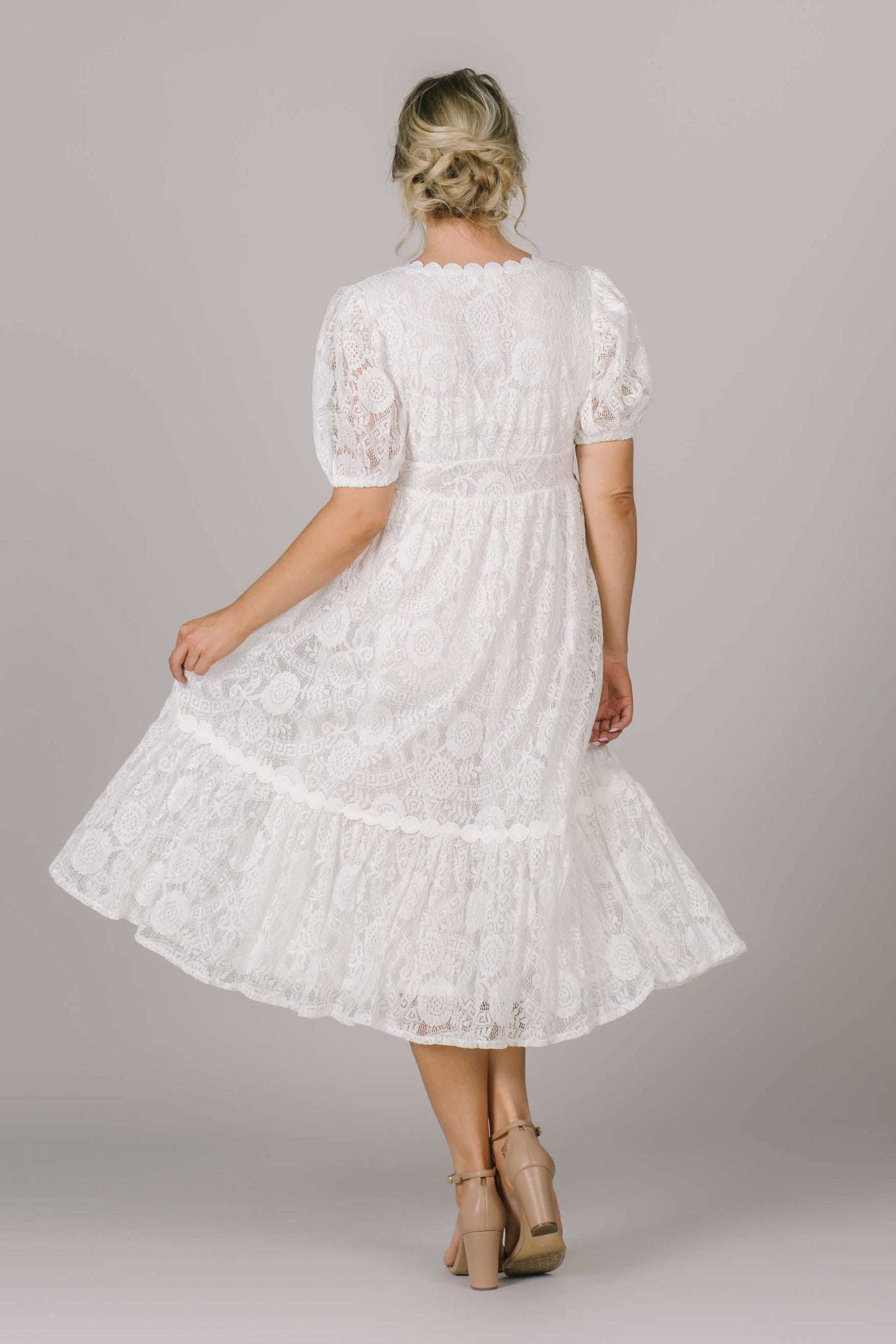 Perfect modest dress with lace detail all over, and gorgeous sheer puff sleeves. 