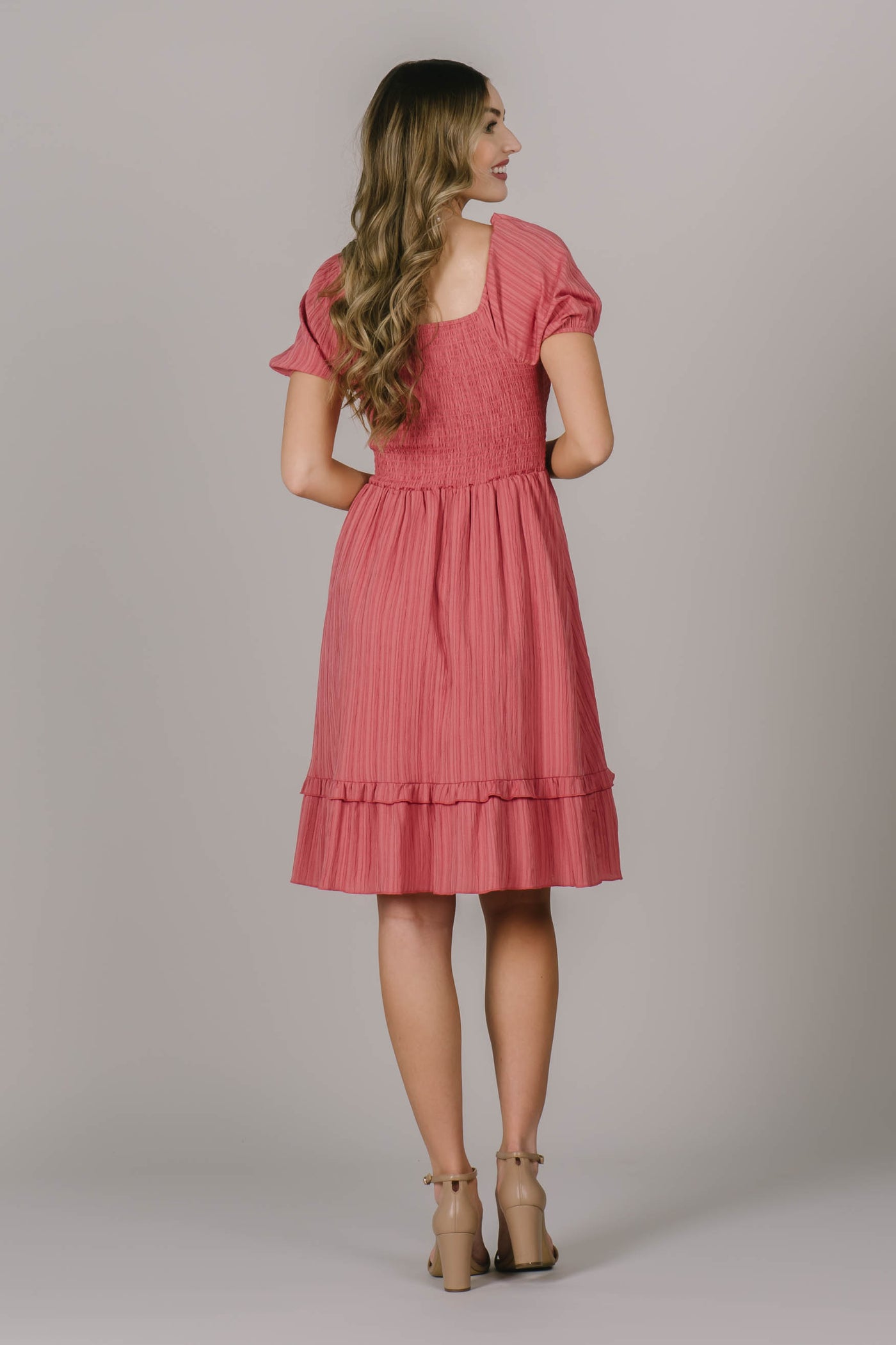 Back of modest dress in Utah with comfortable smocking in the back, a soft square neckline, and a cute tiered seam detail.