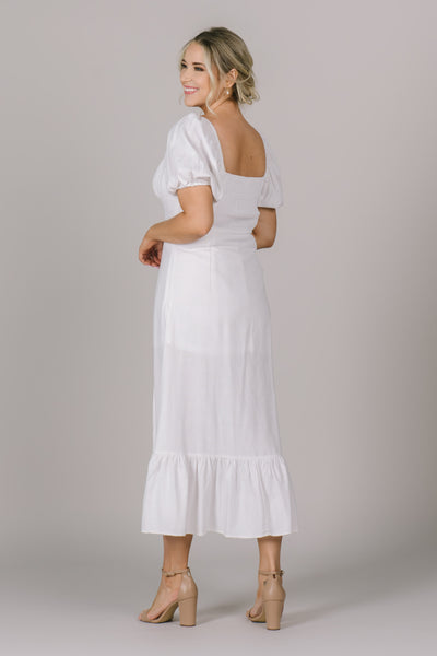 Back shoot of modest dress,  Marilyn, with a square neckline, and tiered ruffle on bottom of dress. 