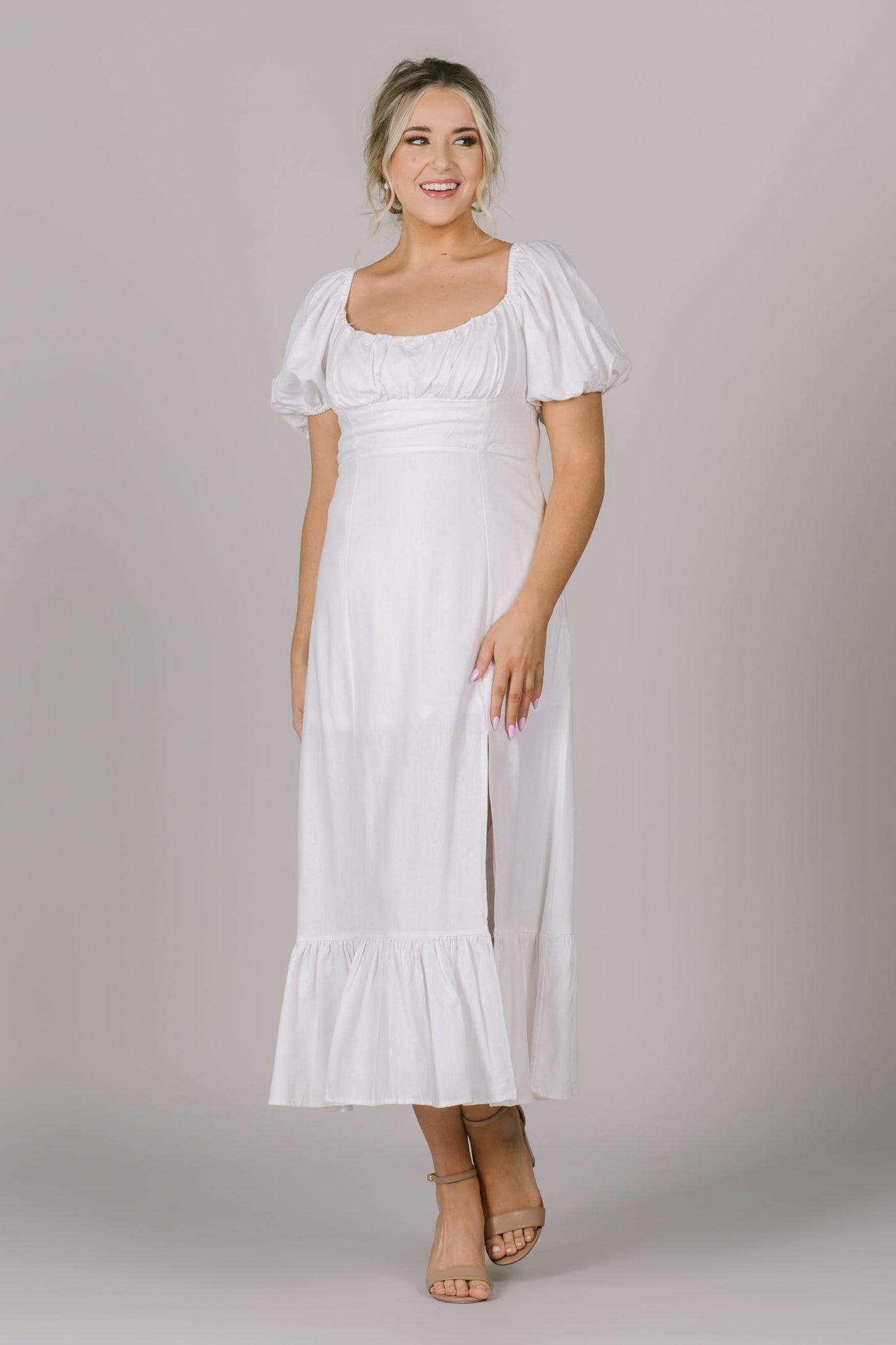 Beautiful white modest dress for any occasion.  Puff sleeves, square neckline, slit over knee and tiered ruffle on bottom. 
