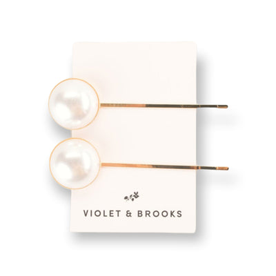 This gold bobby pin duo features an oversized pearl detail and is the perfect accessory for everyday modest dresses. 