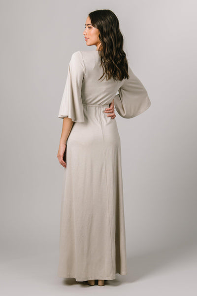 This Maxi Modest Dress features a shimmery fabric and wrap bodice with elbow length flutter sleeves. - Modest Dresses - Modest Clothing - Modest Bridesmaids Dresses