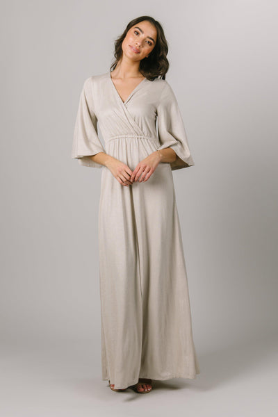This Maxi Modest Dress features a shimmery fabric and wrap bodice with elbow length flutter sleeves. - Modest Dresses - Modest Clothing - Modest Bridesmaids Dresses