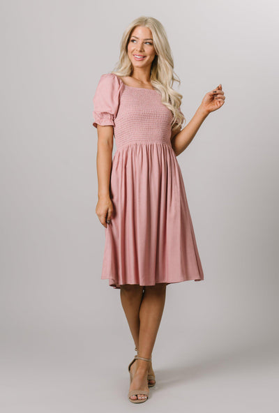 Modest Dresses - Everyday Modest Dresses - Bridesmaid Modest Dresses. This dress on the model is a size small, it is knee length.  Th bodice is smocked and it has puff sleeves. 
