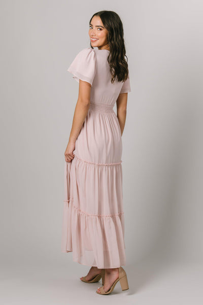 Modest Dresses - Modest Clothing - Everyday Modest Dresses - Bridesmaid Modest Dresses A side view of a chiffon dress. A smocked waist with tiered panels. With flutter sleeves and a v neckline. 