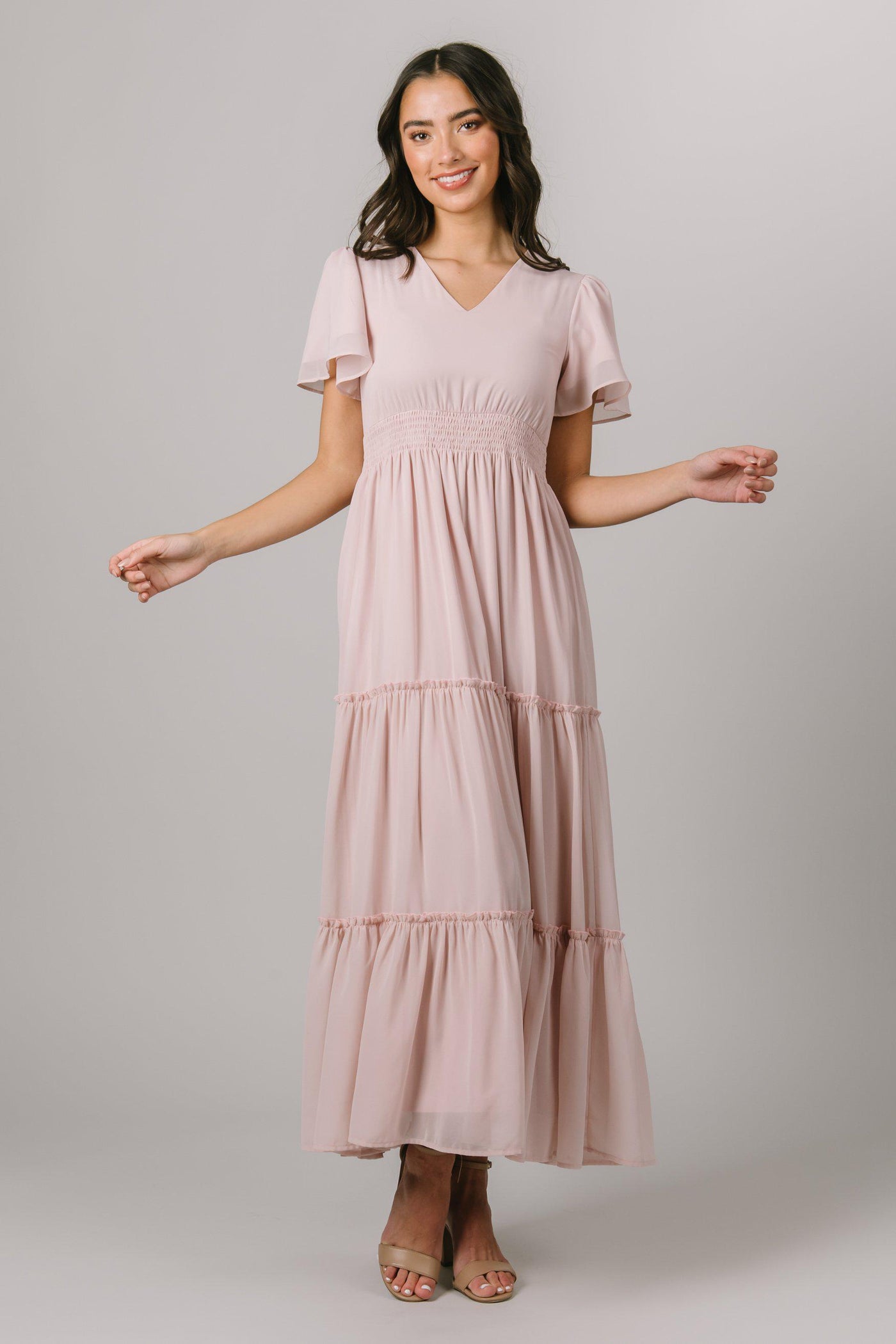 We're loving this modest dress! It features a cinched waistband, flutter sleeves and a tiered skirt. - Modest Dresses - Modest Clothing - Modest Bridesmaid Dresses
