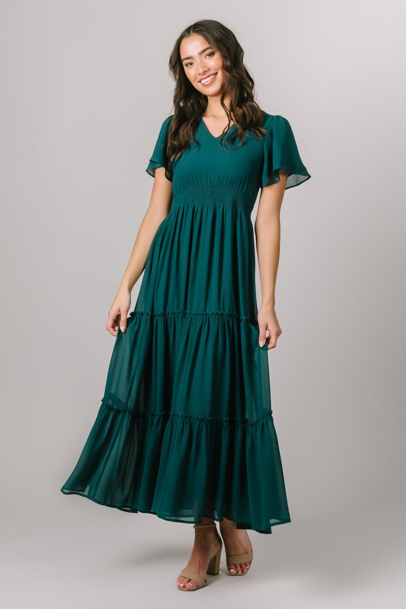 This fun Modest Dress features flutter sleeves, a cinched waist and tiered skirt. - Modest Dresses -Modest Clothing - Modest Bridesmaid Dresses