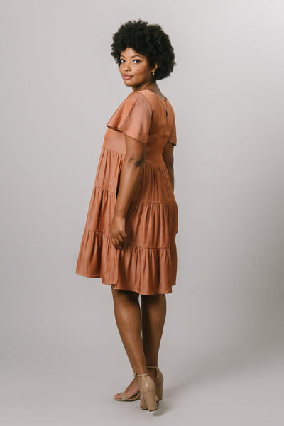 Side view of the tiered dress with flutter sleeves in burnt ginger.Modest Dresses - Modest Clothing - Everyday Modest Dresses - Bridesmaid Modest Dresses