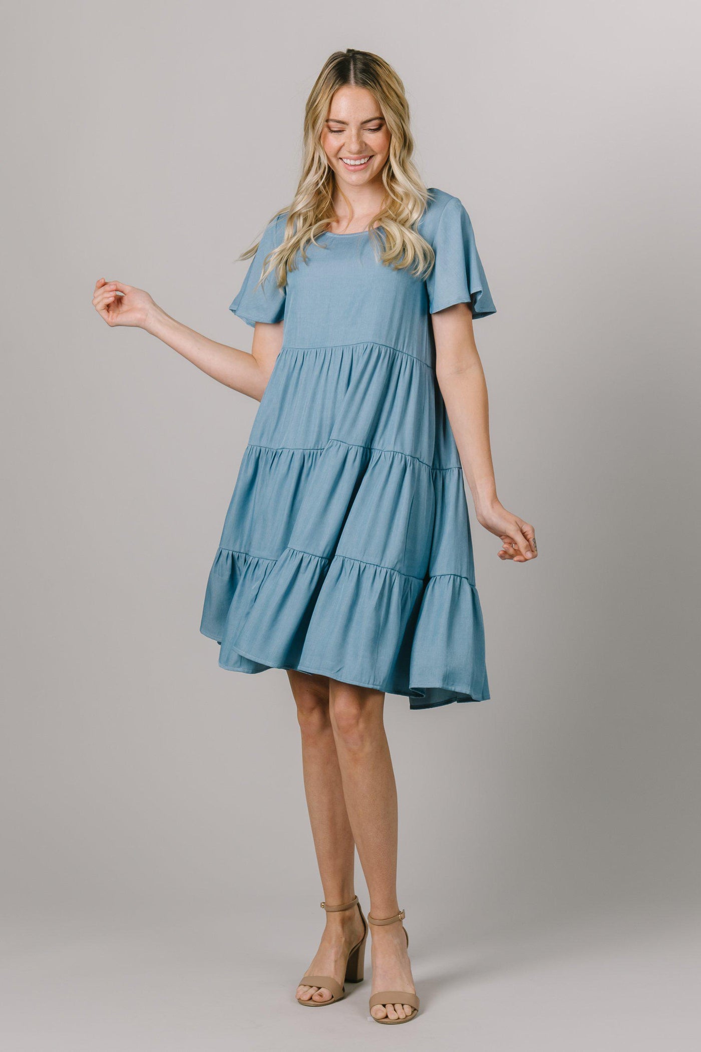 We're obsessed with this tiered modest dress that features flutter sleeves and a round neckline. - Modest Clothing - Modest Dresses - Modest Everyday Dresses 