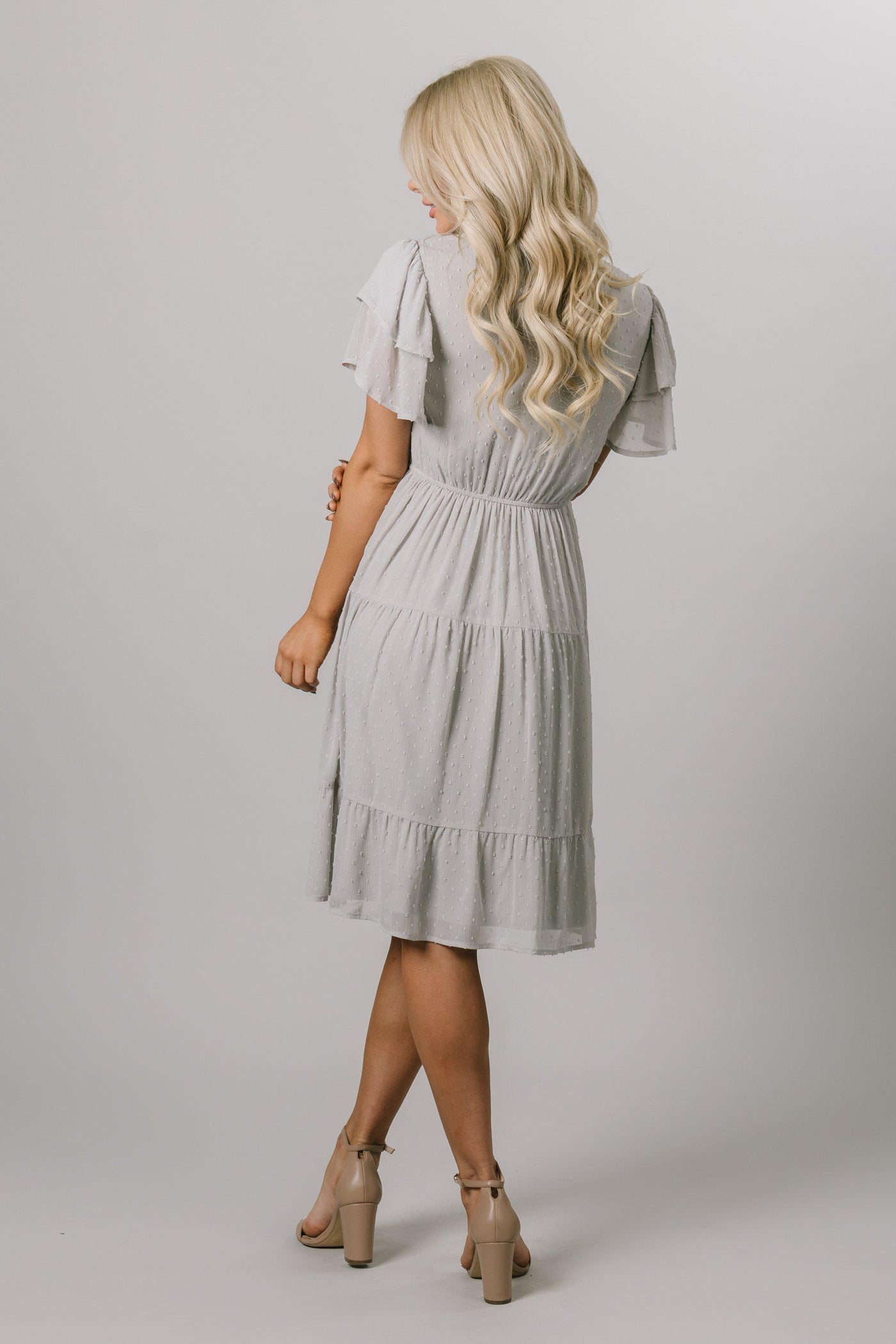 Modest Dresses - Modest Clothing - Everyday Modest Dresses - Bridesmaid Modest Dresses. The back of the knee length dress with three panels. The sleeves have flutter sleeves with two tiers. 