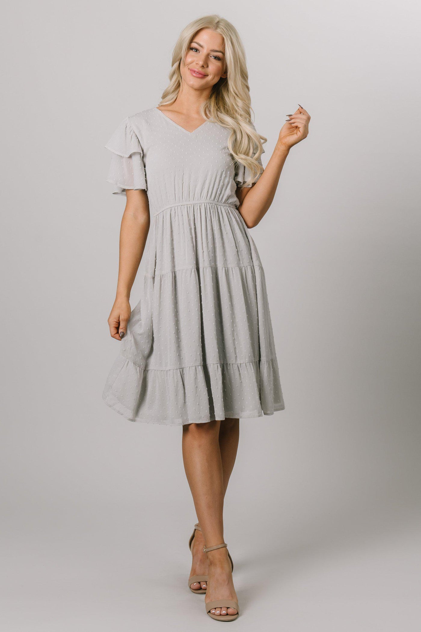 Modest Dresses - Modest Clothing - Everyday Modest Dresses - Bridesmaid Modest Dresses. Modest knee length dress tha has swiss dots all around and flutter sleeves. It comes in faded blue with a v-neckline.