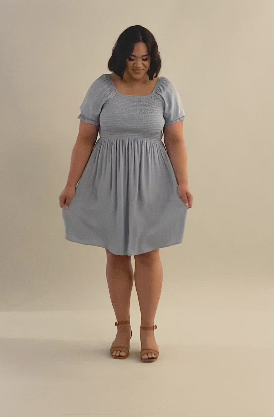 Video of a smocked puff sleeve in faded denim sheen. Modest Dresses - Everyday Dresses - Modest Prom Dress - Formalwear Modest Dresses - Bridesmaid Modest Dresses.