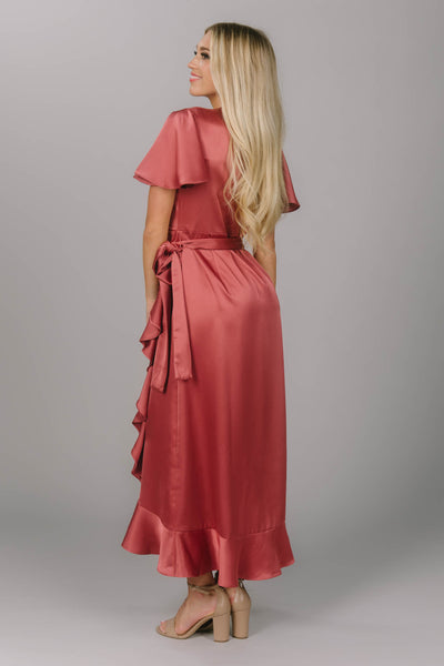 Back view of silk modest bridesmaid dress. It is a wrap style dress with ruffles and gorgeous flutter sleeves. This is the perfect modest dress for all body types.