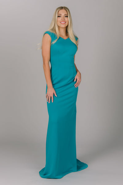 Blue modest prom dress with v-neckline and cap sleeves. This fitted dress is perfect for a number occasions. This dress could be a modest prom dress or modest bridesmaid dress.