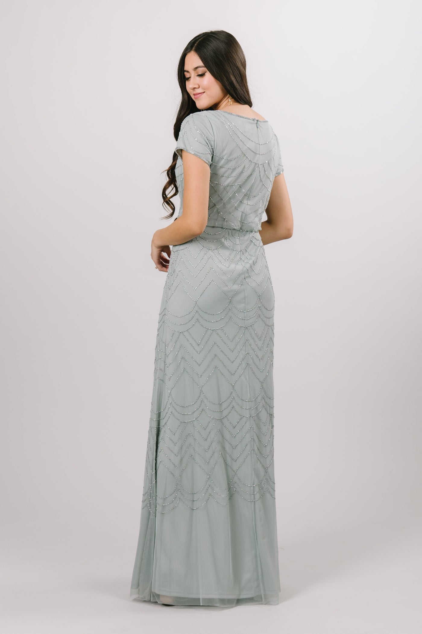 The modest bridesmaid or prom dress creates a pop over bodice and a delicate fitted skirt, not to mention the draped beaded pattern. In the color Sage.Modest Dresses - Modest Clothing - Modest Formalwear Dresses - Bridesmaid Modest Dresses. 