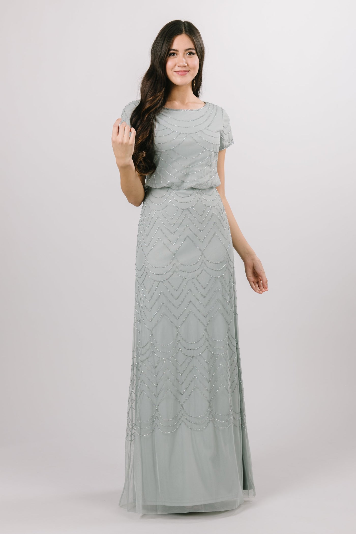 The modest bridesmaid or prom dress creates a pop over bodice and a delicate fitted skirt, not to mention the draped beaded pattern. In the color Sage. Modest Dresses - Modest Clothing - Modest Formalwear Dresses - Bridesmaid Modest Dresses. 