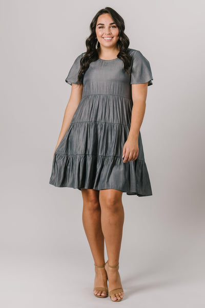 This plus size modest bridesmaids dress has a scoop neck, short sleeves and multiple tiers that are flattering on every figure. Shown in Pine. Modest Dresses - Modest Clothing - Everyday Modest Dresses - Bridesmaid Modest Dresses