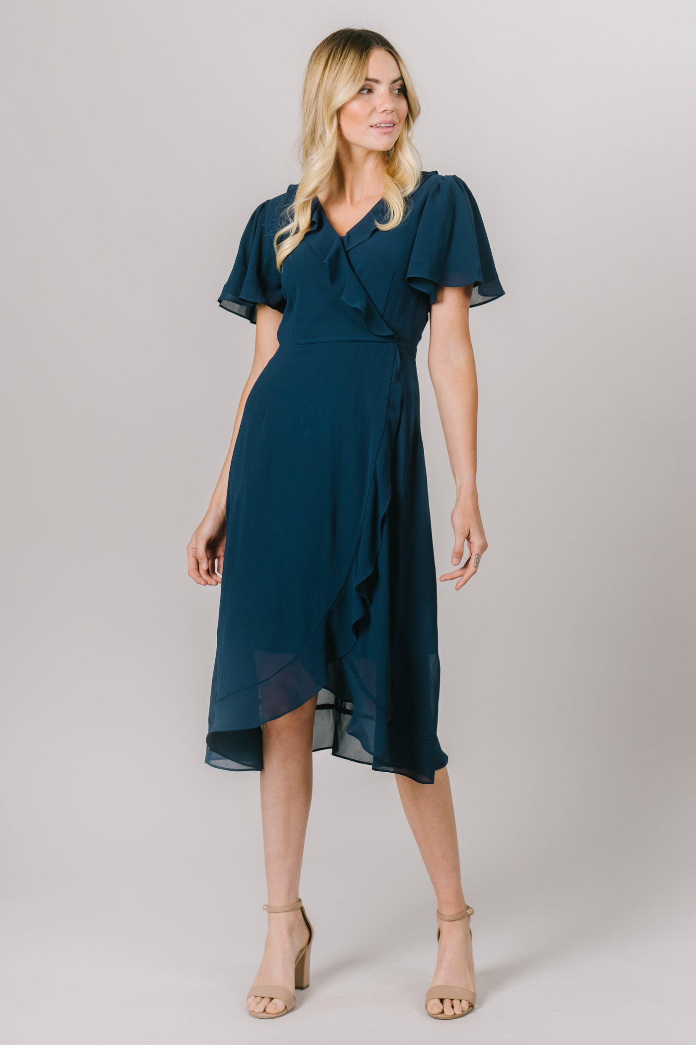 This fun modest dress is perfect for your everyday moments! It features a flattering fit and ruffles following the wrap shape! The sleeves also add a touch of fun!  Also available in Burgundy. Modest Dresses - Modest Clothing - Everyday Modest Dresses - Bridesmaid Modest Dresses. 