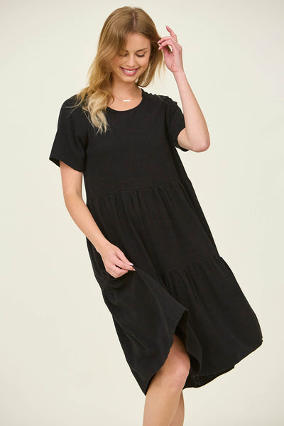 The front view of a flowy black dress with flutter sleeves at a modest dress shop in Bluffdale.