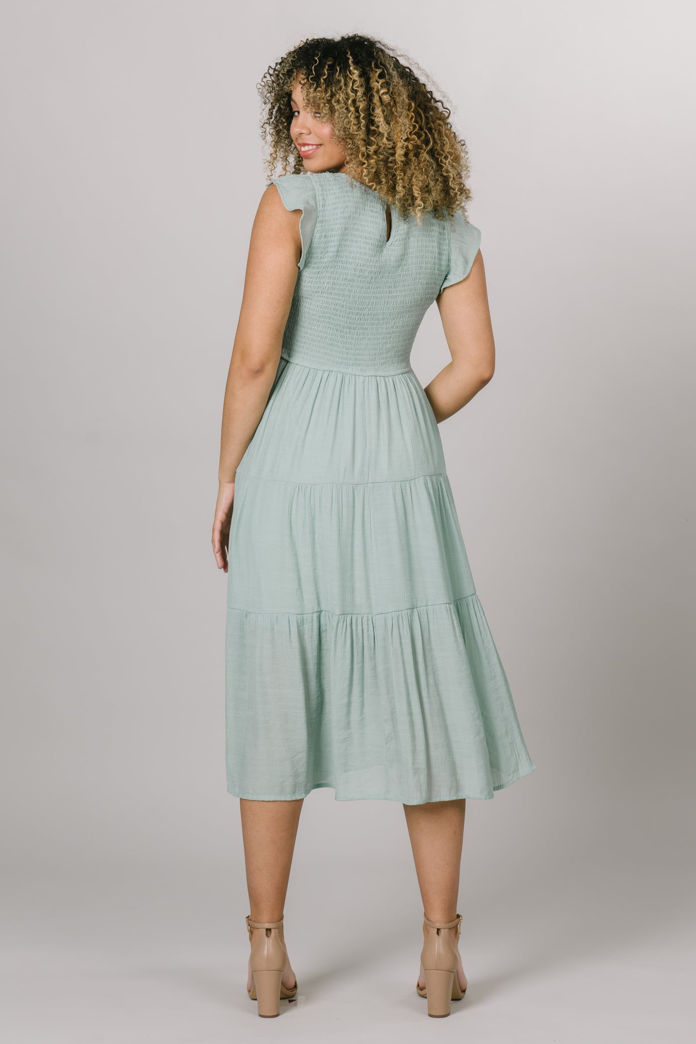 Back view of the dress with  smocked bodice and short sleeves. Modest Dresses - - Everyday Dresses - Modest Prom Dress - Formalwear Modest Dresses - Bridesmaid Modest Dresses.
