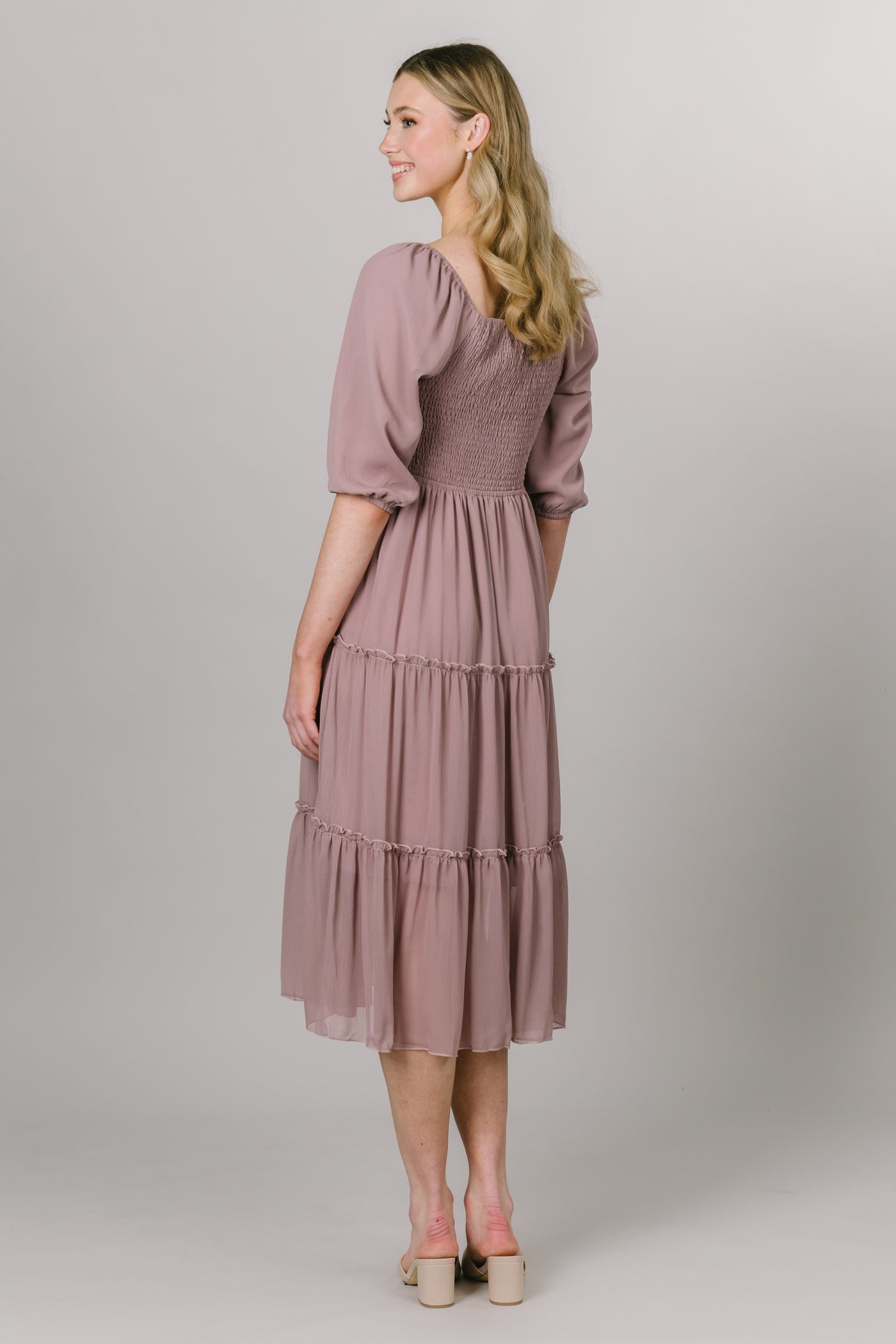 The back view of the square neck line with puff sleeves and a smocked bodice and tiered panel skirt. Modest Dresses - Everyday Dresses - Modest Prom Dress - Formalwear Modest Dresses - Bridesmaid Modest Dresses.