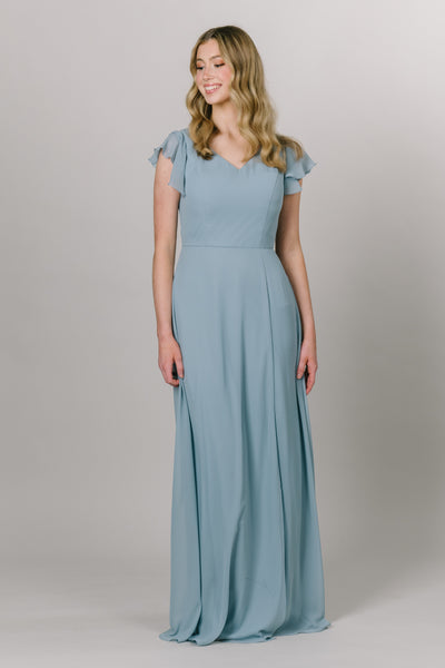 Model in a A line chiffon blue dress that is floor length. Modest Dresses - Modest Prom Dress - Formalwear Modest Dresses - Bridesmaid Modest Dresses. 