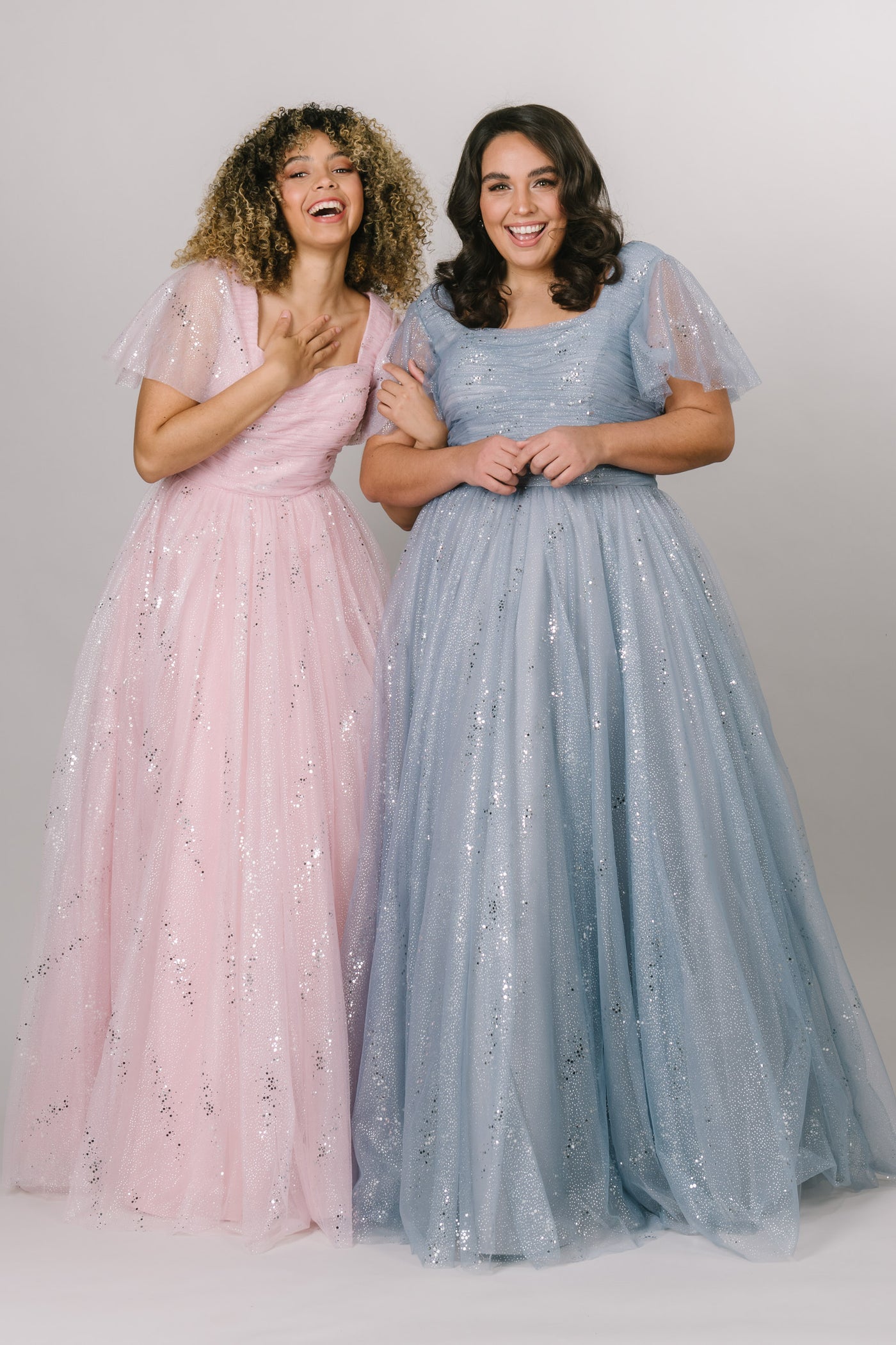 Modest Dresses - Modest Prom Dress - Formalwear Modest Dresses - Bridesmaid Modest Dresses Model showing ballgown in Pink and Blue side by side.