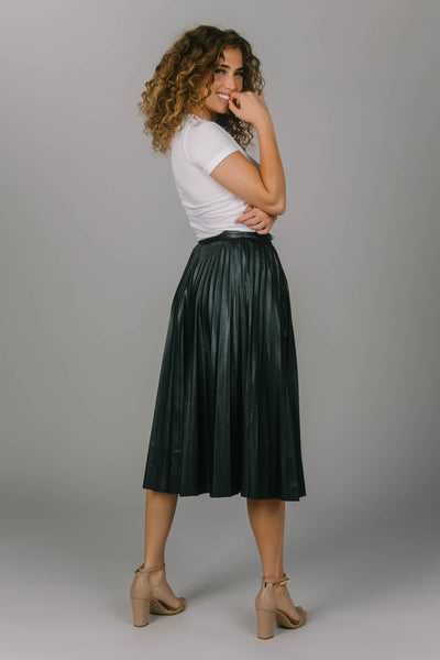 Modest black pleated skirt. It is mid-calf length and zips in the back. Perfect addition to your modest wardrobe.